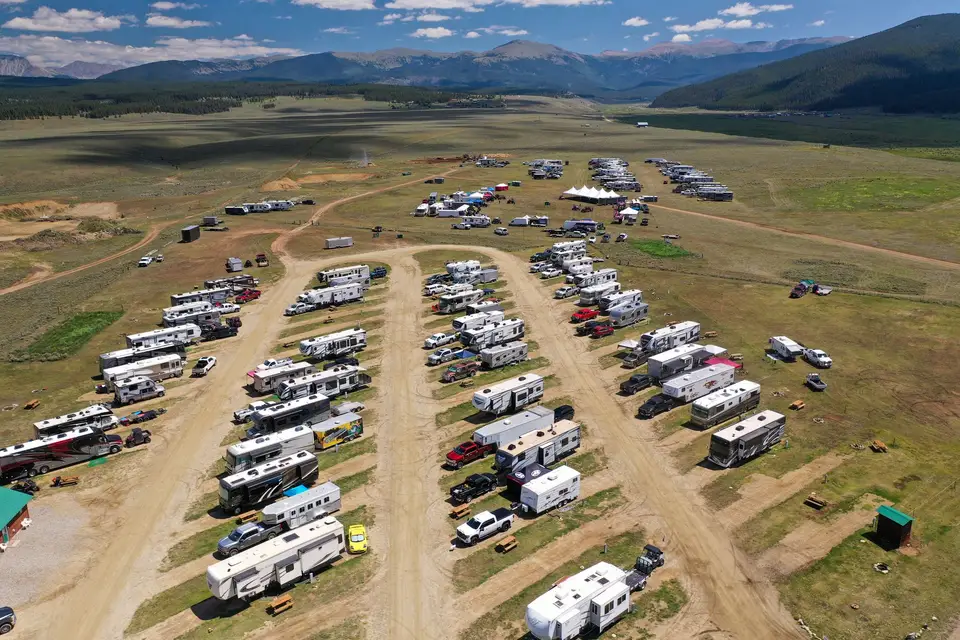 Drone view of the RV park rows with the valley and mountains beyond