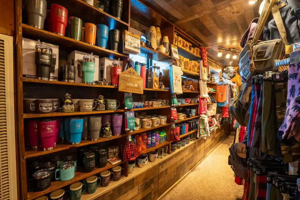 Mugs, tumblers and keepsakes on gift shop shelves