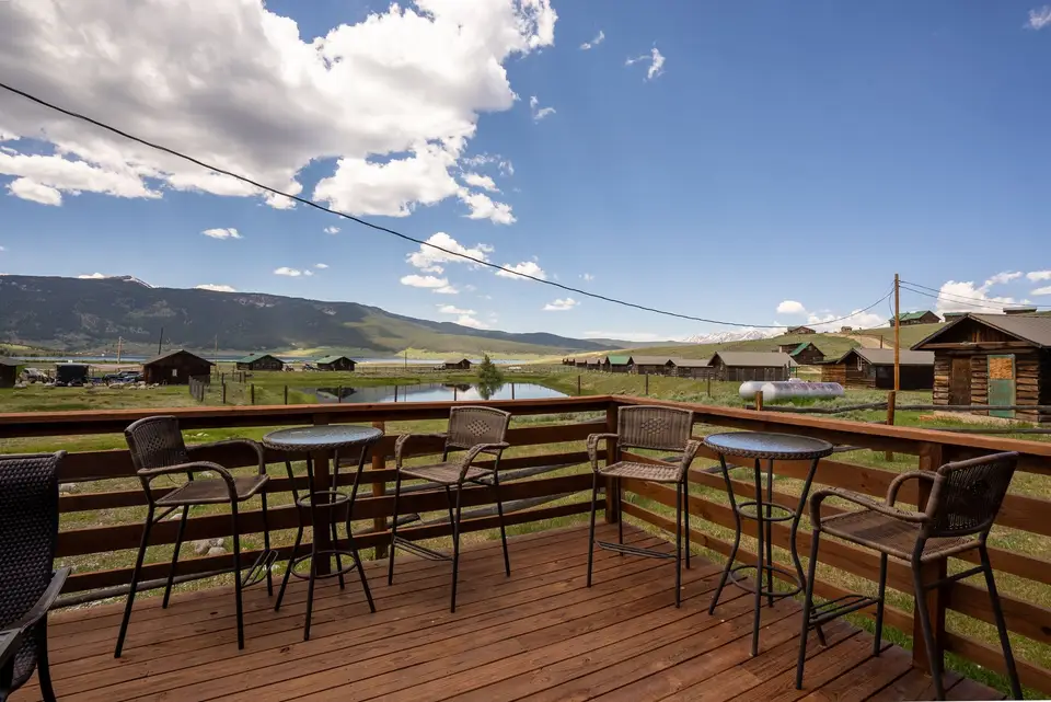 Bar-height tables on the Nugget Cafe deck in the sun