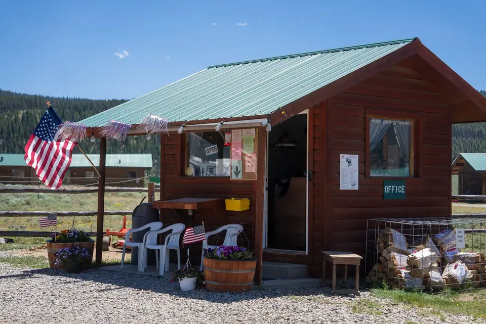 RV office porch with chairs and an American flag