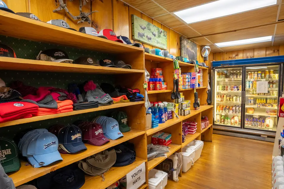 Caps, sweatshirts and souvenir apparel on the store wall