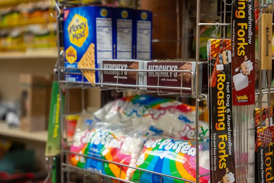 Marshmallows and camp snacks on a Trading Post rack